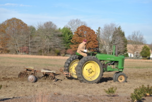 Louis Godena plowing the fields in his John Deer.